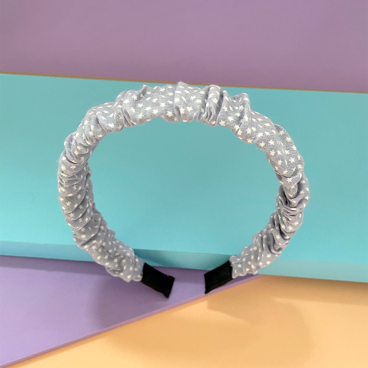 Diadema para el cabello Peschelle con estrellas color azul