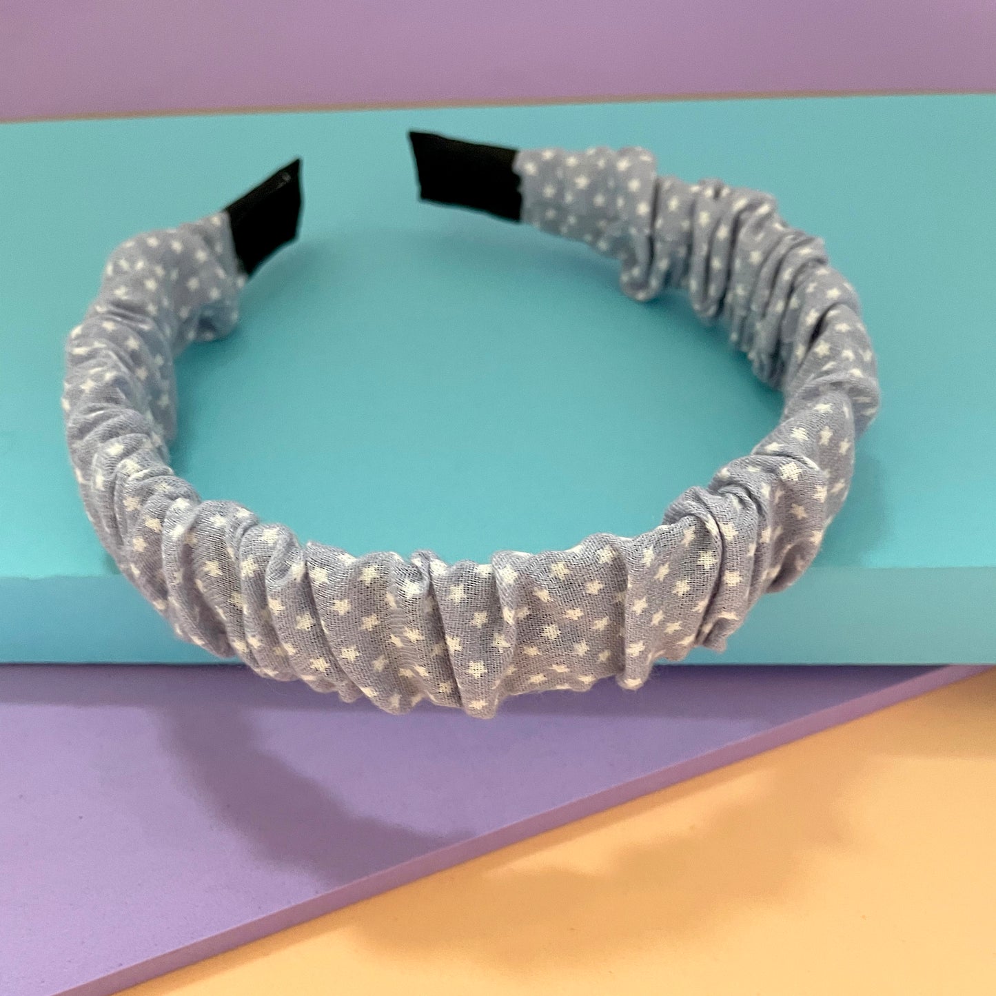 Diadema para el cabello Peschelle con estrellas color azul