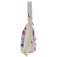Bolsa [Baby Phat] tipo tote con diseño floreado color blanco
