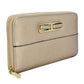 Cartera para dama Peschelle con moño decorativo color oro