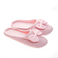 Pantufla [Peschelle] afelpada con diseño de moño color rosa